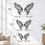 Black metal Elegant Butterfly wings wall art with intricate cutout details displayed on the wall