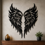 Black metal Flame Style Angel wings wall art with intricate cutout details displayed on the wall