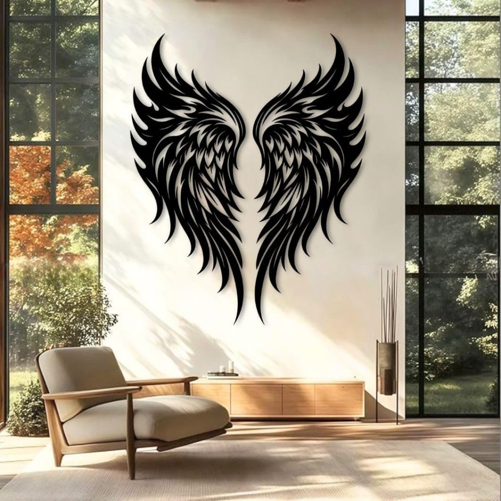 Black metal Flame Style Angel wings wall art with intricate cutout details displayed on the wall