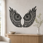 Black metal Floral Angel wings wall art with intricate cutout details displayed on the wall