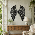 Black metal Floral Angel wings wall art with intricate cutout details displayed on the wall