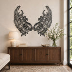 Black metal Mystic Phoenix wings wall art with intricate cutout details displayed on a beige paneled wall