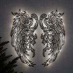 Black metal Mystic Phoenix wings wall art with Soft White LED Lighting displayed on the wall
