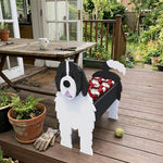 Newfoundland dog planter filled with fresh flowers is placed in the garden