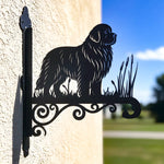 Newfoundland metal hanging basket bracket mounted on outdoor wall for plant decoration