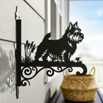 Norwich terrier metal hanging basket bracket mounted on outdoor wall for plant decoration