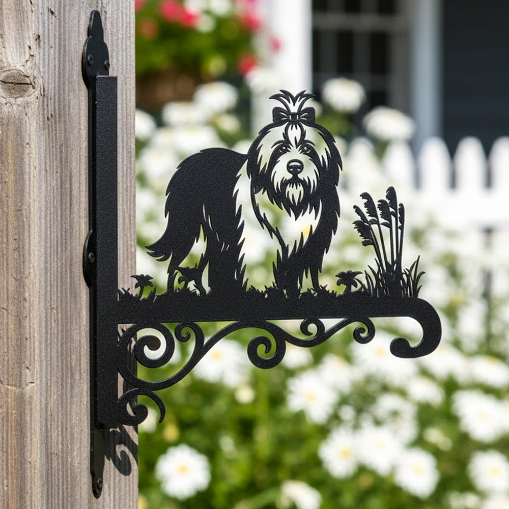 Old english sheepdog metal hanging basket bracket mounted on outdoor wall for plant decoration