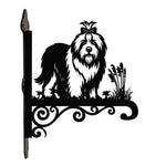 Old english sheepdog metal hanging basket bracket mounted on outdoor wall for plant decoration