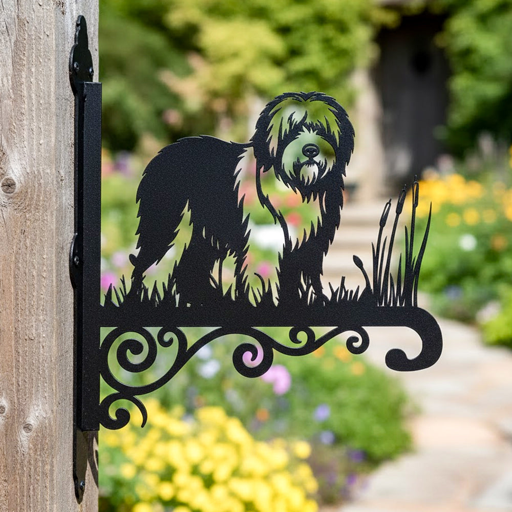 Old english sheepdog metal hanging basket bracket mounted on outdoor wall for plant decoration
