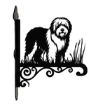 Old english sheepdog metal hanging basket bracket mounted on outdoor wall for plant decoration