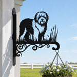 Old english sheepdog metal hanging basket bracket mounted on outdoor wall for plant decoration