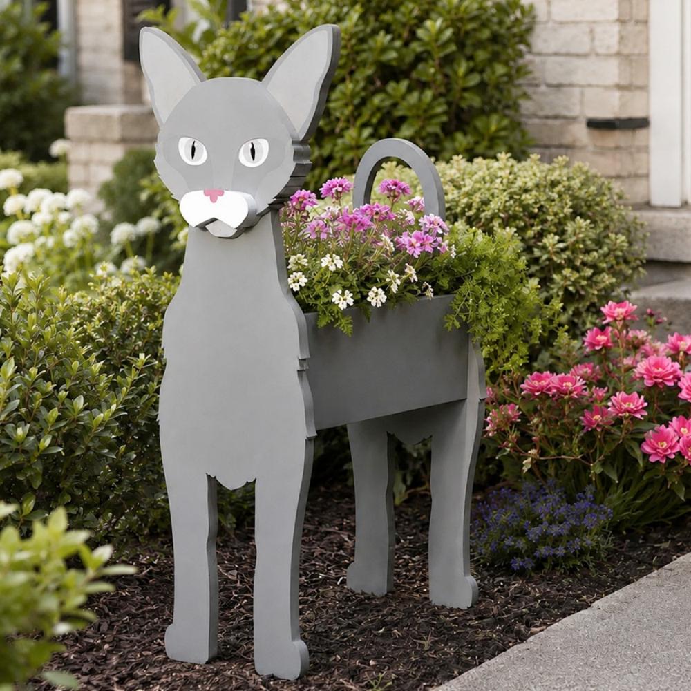 Oriental Shorthair cat planter filled with fresh flowers is placed in the garden