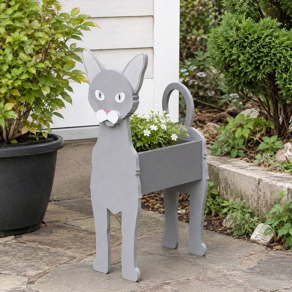 Oriental Shorthair cat planter filled with fresh flowers is placed in the garden