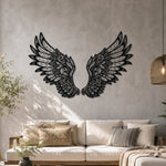 Black metal Ornate Angel wings wall art with intricate cutout details displayed on the wall