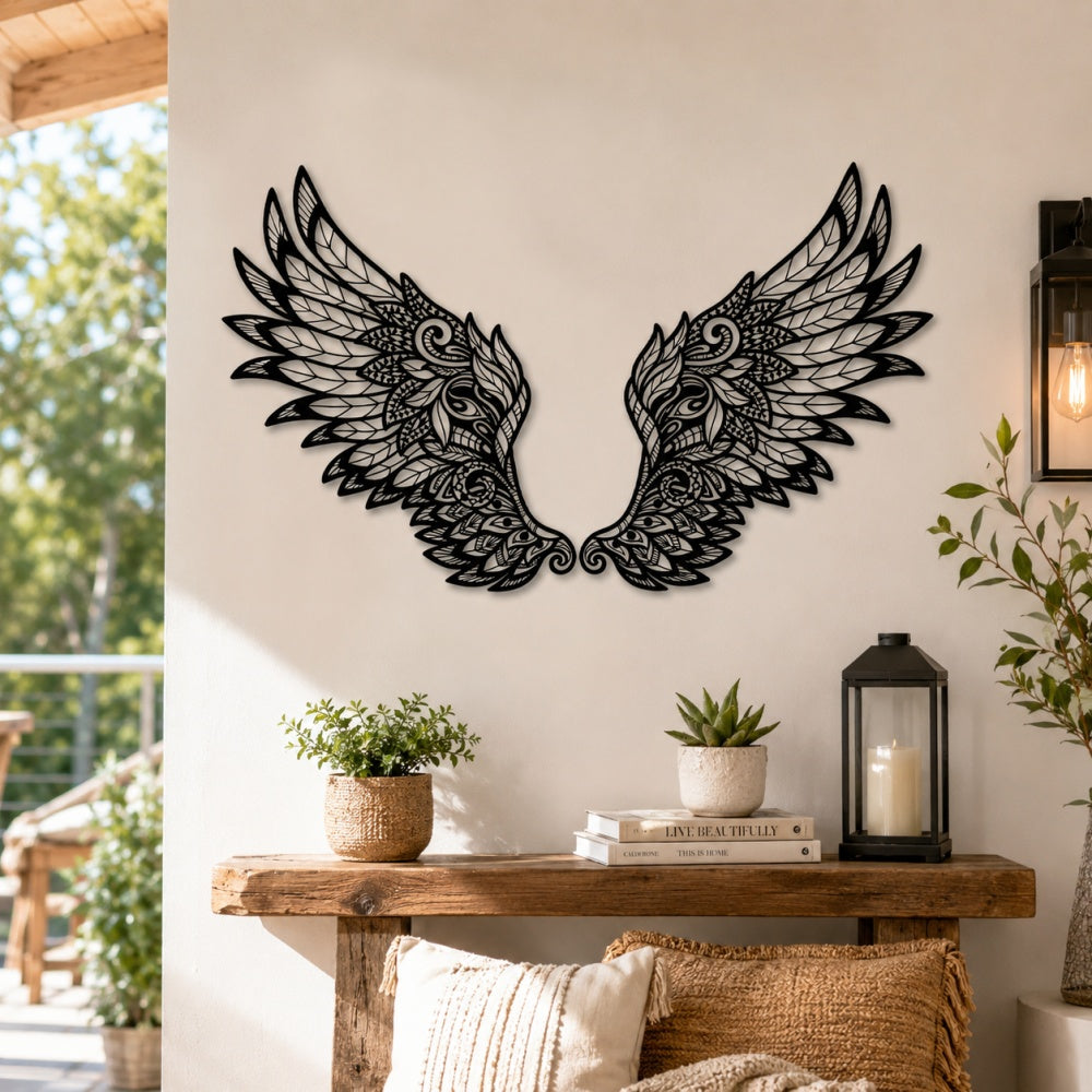 Black metal Ornate Angel wings wall art with intricate cutout details displayed on the wall