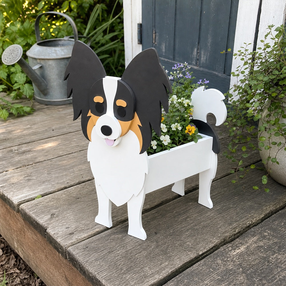 Papillon dog planter filled with fresh flowers is placed in the garden