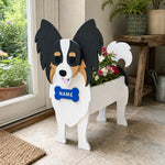 Papillon dog planter filled with fresh flowers is placed in the room