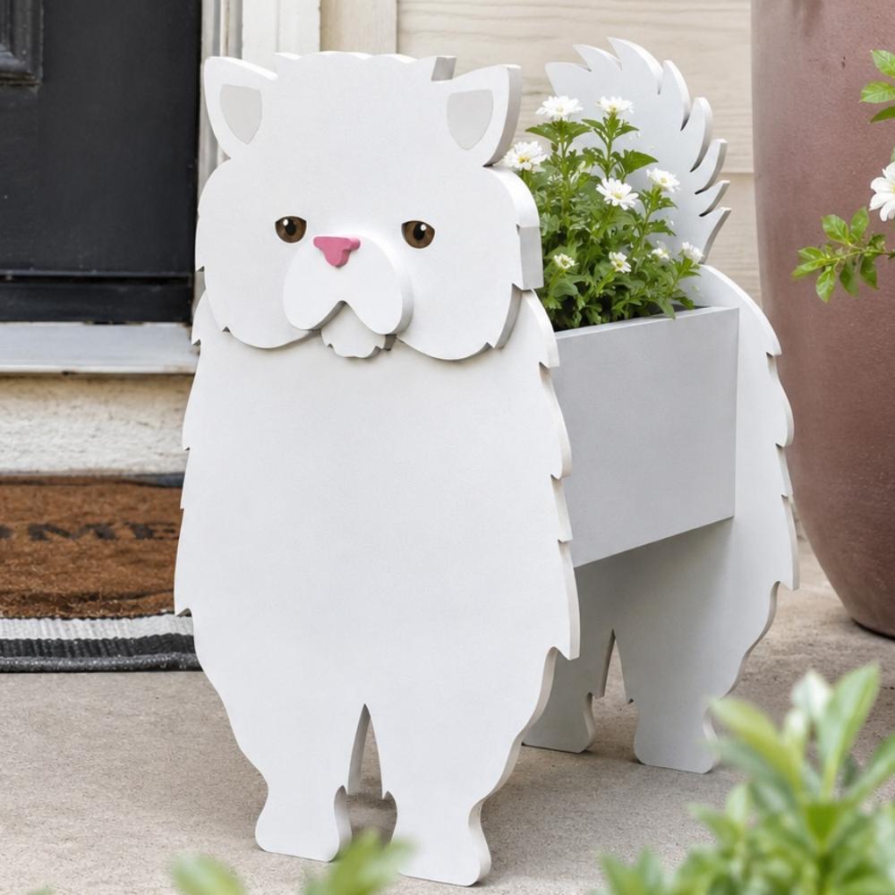Persian cat planter filled with fresh flowers is placed in the garden
