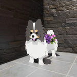 Pomeranian dog planter filled with fresh flowers is placed in the garden