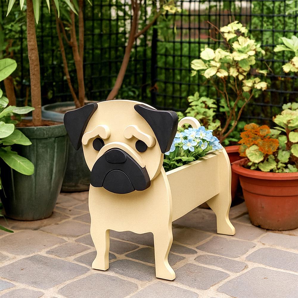 Fawn pug dog planter with black ears and face on a patio with plants in the background