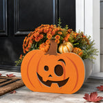 Halloween Planter Pumpkin planter filled with fresh flowers is placed in the garden