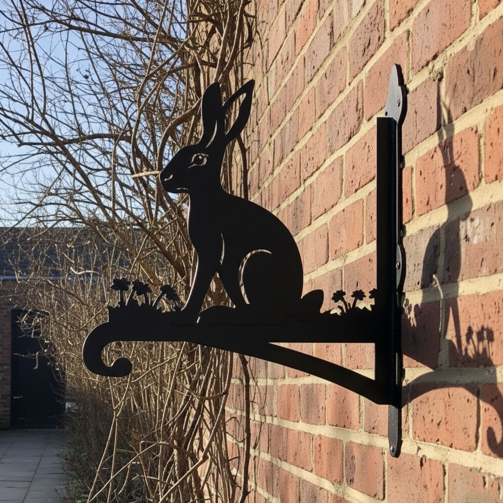 Rabbit metal hanging basket bracket mounted on outdoor wall for plant decoration