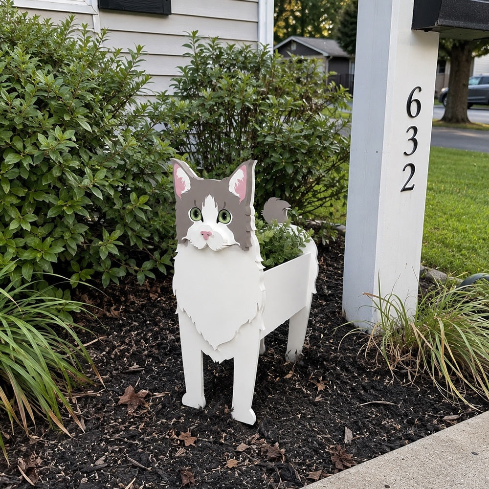 Ragdoll cat planter filled with fresh flowers is placed in the garden