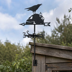 Raven on skull metal weather vane with directional arrows and mounting rod, outdoor roof and garden decoration