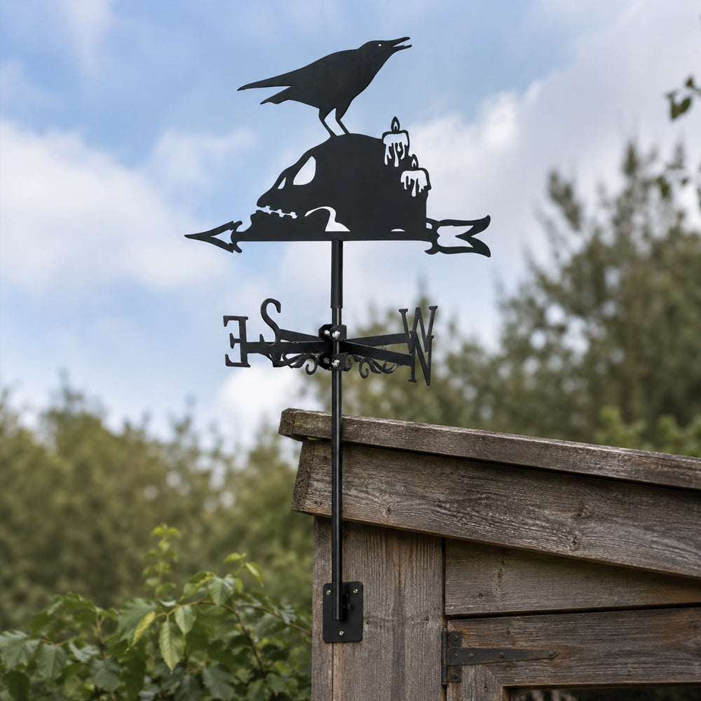 Raven on skull metal weather vane with directional arrows and mounting rod, outdoor roof and garden decoration