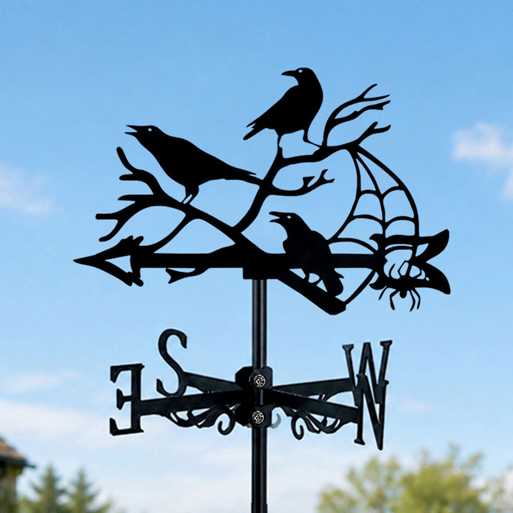 Ravens on branches with spider metal weather vane with directional arrows and mounting rod, outdoor roof and garden decoration