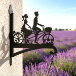 Romantic couple on tandem bicycle metal hanging basket bracket mounted on outdoor wall for plant decoration