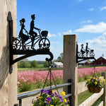 Romantic couple on tandem bicycle metal hanging basket bracket mounted on outdoor wall for plant decoration