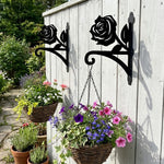Rose metal hanging basket bracket mounted on outdoor wall for plant decoration