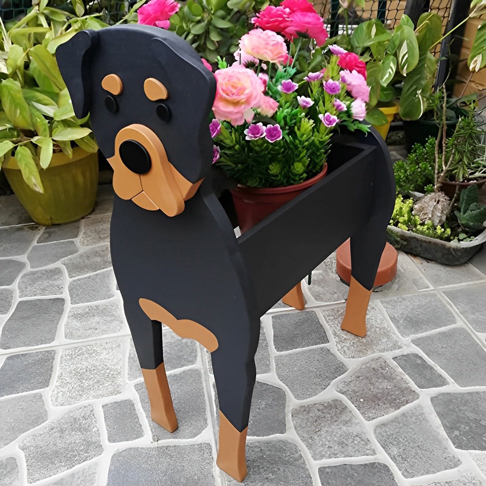 Rottweiler dog planter filled with fresh flowers is placed in the garden