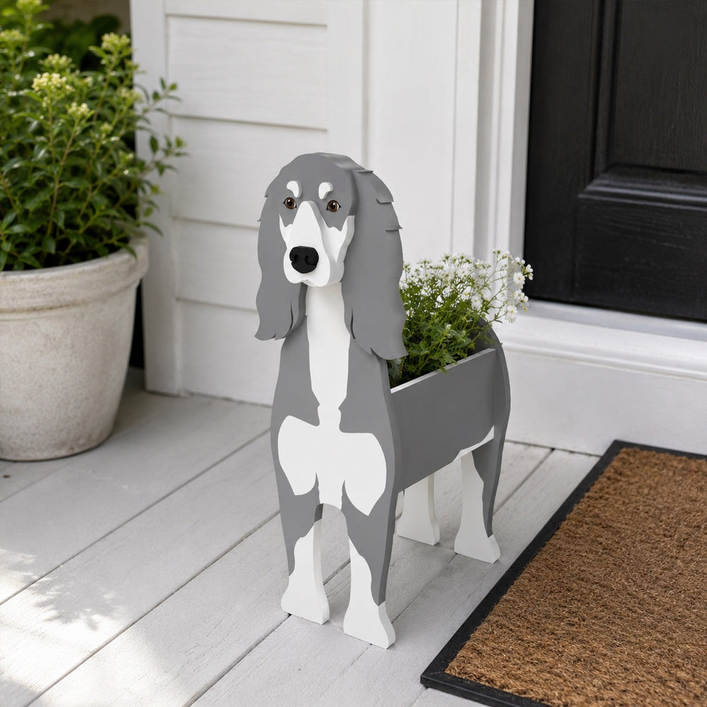 Saluki dog planter filled with fresh flowers is placed in the garden