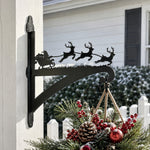 Santa sleigh and reindeer metal hanging basket bracket mounted on outdoor wall for plant decoration