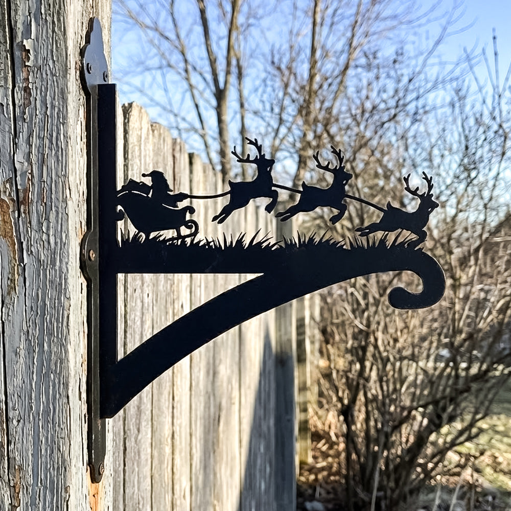 Santa sleigh and reindeer metal hanging basket bracket mounted on outdoor wall for plant decoration