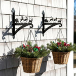 Santa sleigh and reindeer metal hanging basket bracket mounted on outdoor wall for plant decoration
