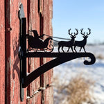 Santa sleigh and reindeer metal hanging basket bracket mounted on outdoor wall for plant decoration