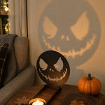 Scary faces halloween metal candle holder casting a spooky shadow on the wall