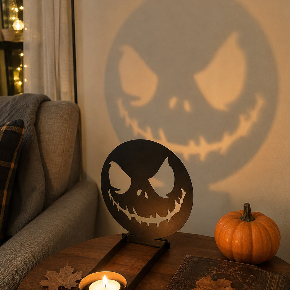 Scary faces halloween metal candle holder casting a spooky shadow on the wall