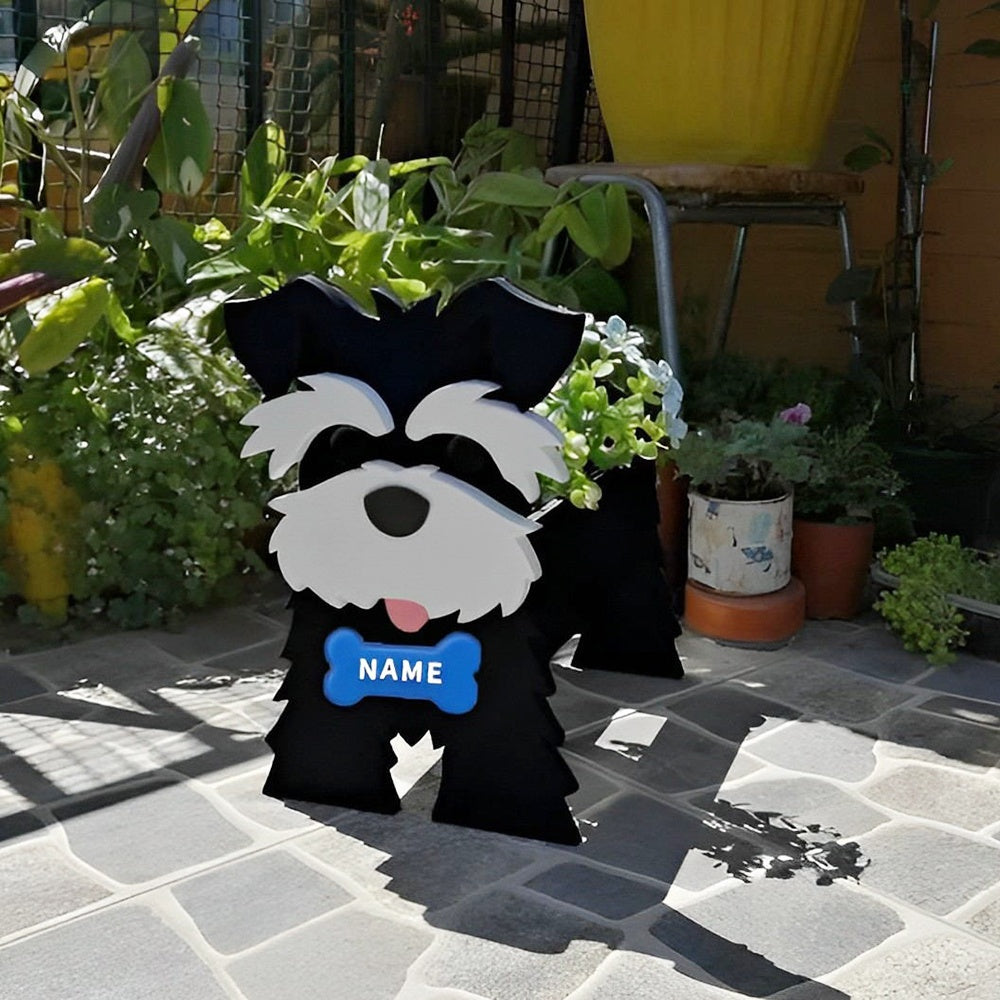 Schnauzer dog planter filled with fresh flowers is placed in the garden
