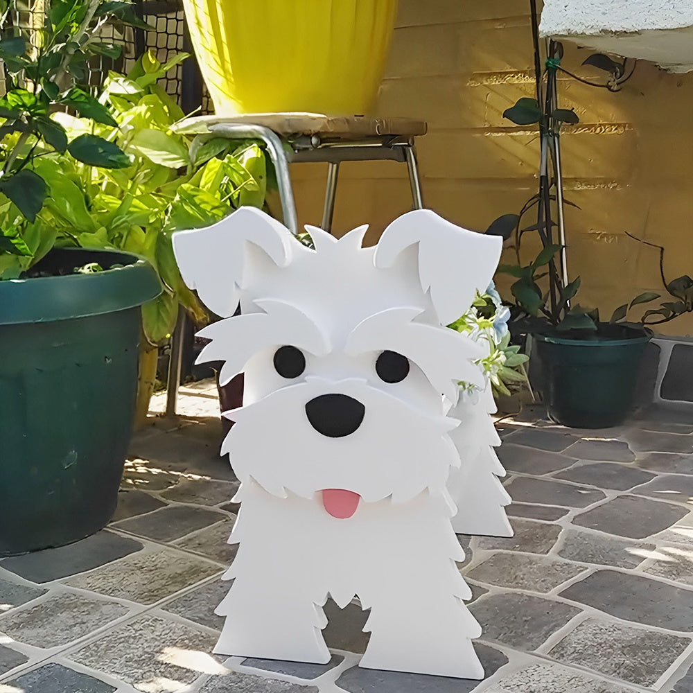 Schnauzer dog planter filled with fresh flowers is placed in the garden