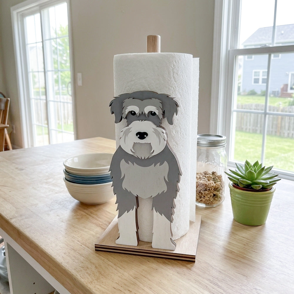 Schnauzer Wooden Dog Paper Towel Holder displayed on a kitchen countertop with a freestanding paper towel roll