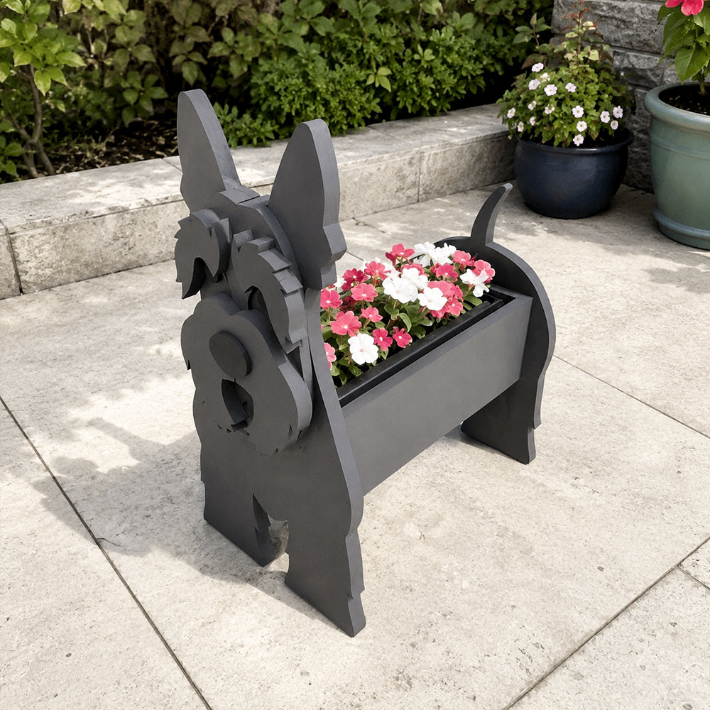 Scottish Terrier dog planter filled with fresh flowers is placed in the garden
