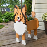 Sheltie-Shetland Sheepdog planter filled with fresh flowers is placed in the garden