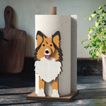 Shetland Sheepdog Wooden Dog Paper Towel Holder displayed on a kitchen countertop with a freestanding paper towel roll
