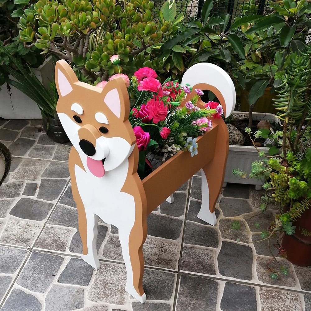 Shiba Inu dog planter filled with fresh flowers is placed in the garden.