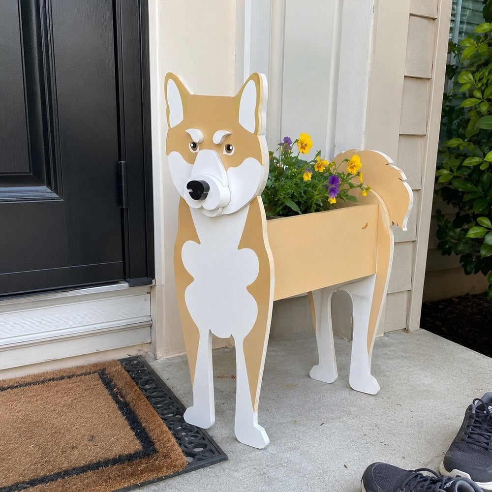 Shiba Inu dog planter filled with fresh flowers is placed in the garden.