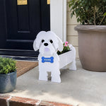 Shih Tzu dog planter filled with fresh flowers is placed in the garden